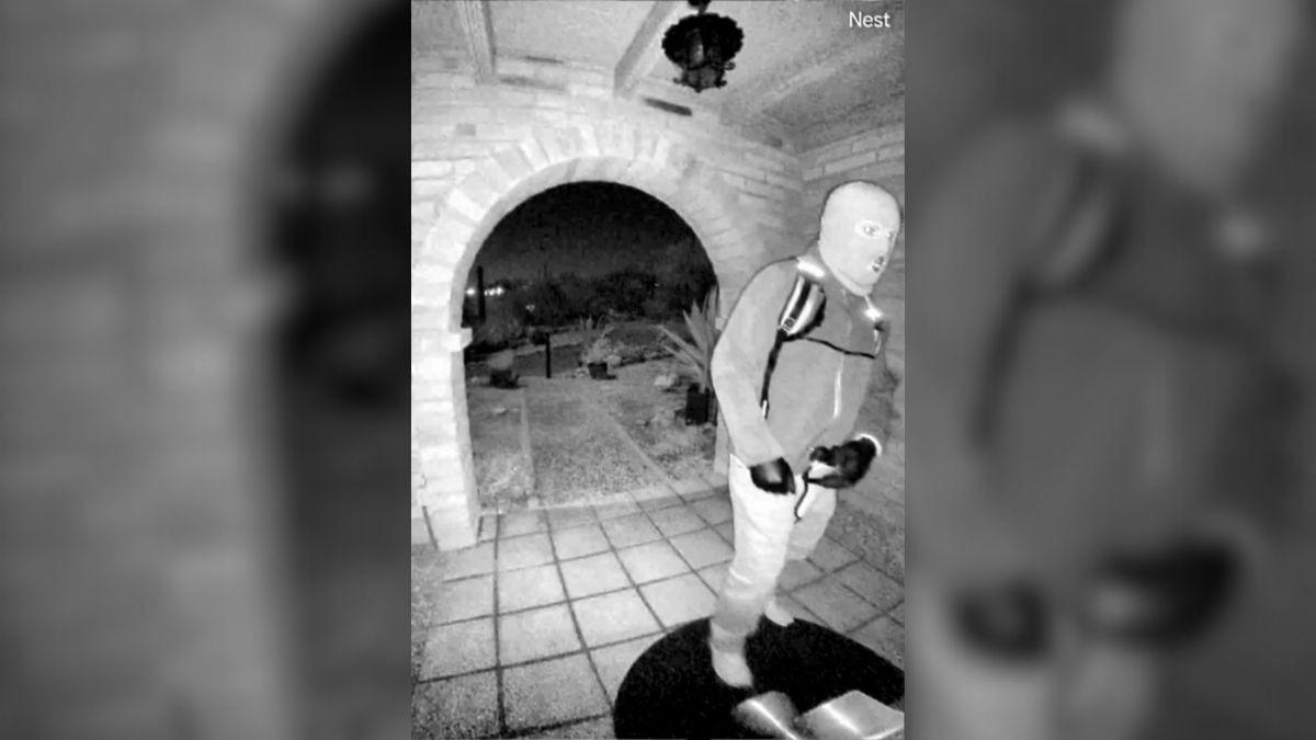 image of Surveillance footage captured a suspicious figure and vehicles near the home that night.