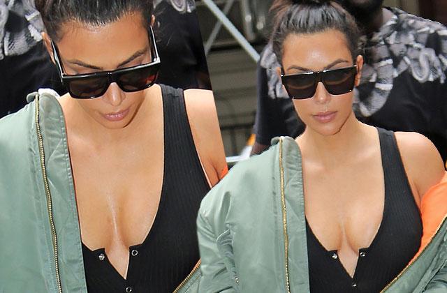 Kim Kardashian flashes nipples as she flaunts major cleavage in