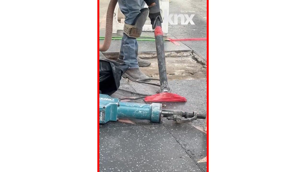 A worker cleans the area that houses Parton's star.