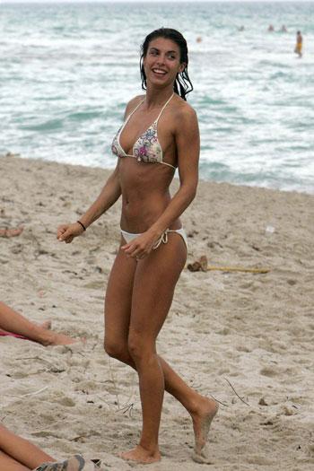 Elisabetta Canalis's bikini reveals a little too much as she