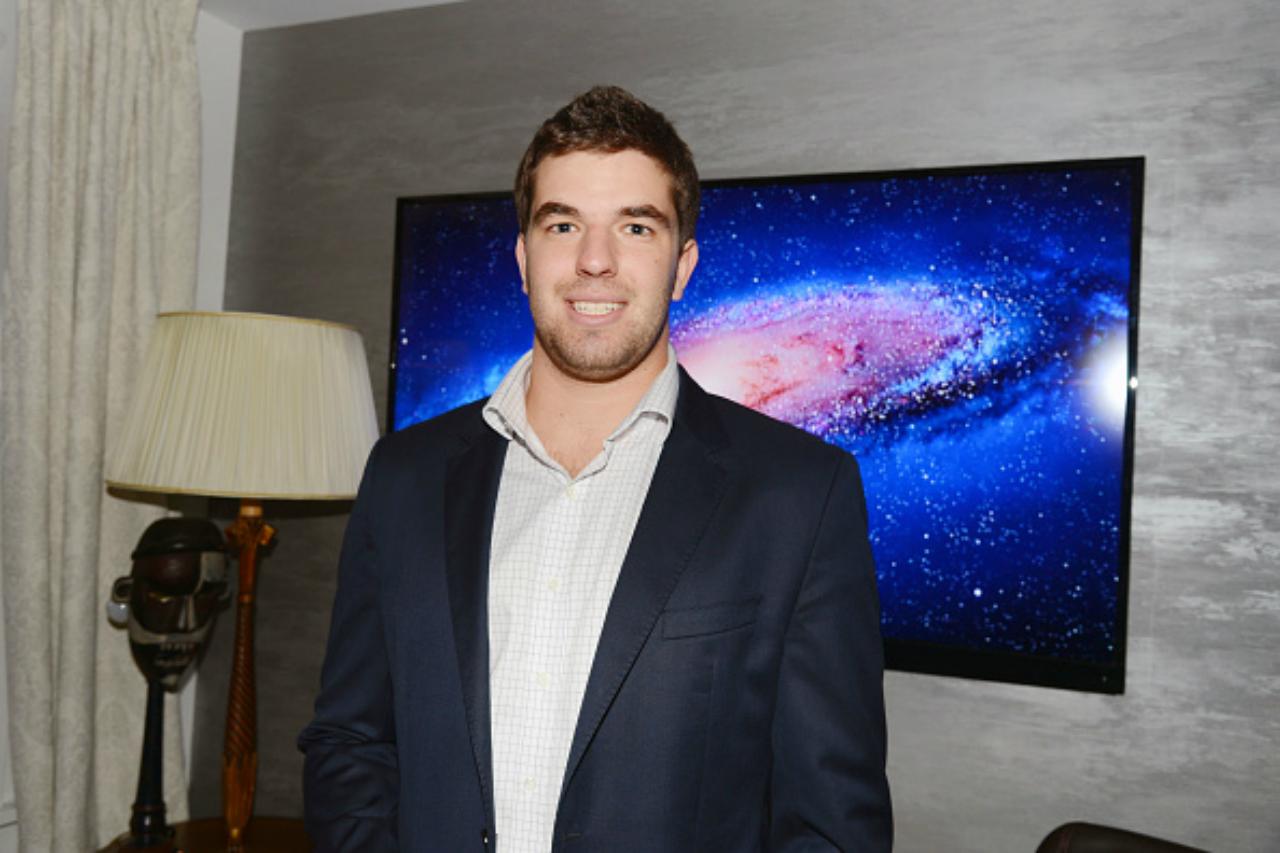 Billy McFarland smiles while posing for a picture.