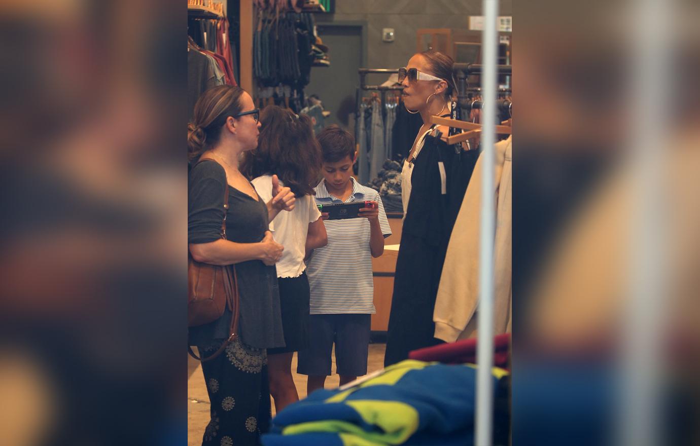 Jennifer Lopez takes her twins Max and Emme shopping at the Lincoln Road Mall in Miami. The group stopped by an Urban Outfitters store to peruse the selection.