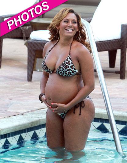 Mel B Shows Off Her Growing Baby Bump In A Bikini