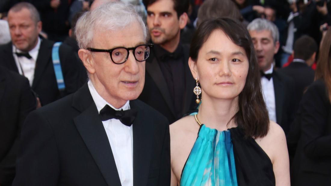 Woody Allen, in a classic tux, held hands with his wife, Soon-Yi Previn, as she wore a sleeveless blue, black and white dress.