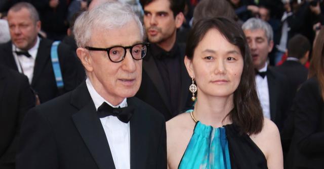 Woody Allen, in a classic tux, held hands with his wife, Soon-Yi Previn, as she wore a sleeveless blue, black and white dress.