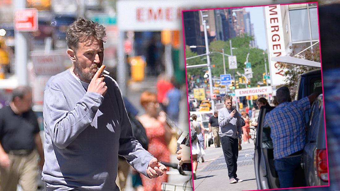 Matthew Perry Wearing Grey Top Smoking a Cigarette On A NYC Street In Font Of Hospital