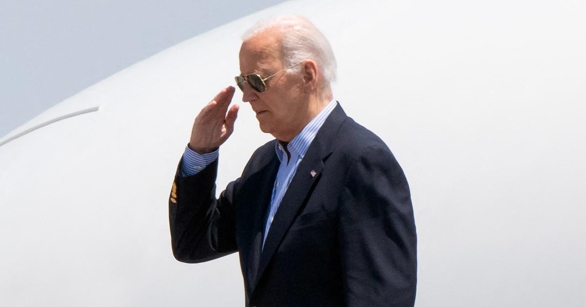 Photo of Joe Biden saluting. 