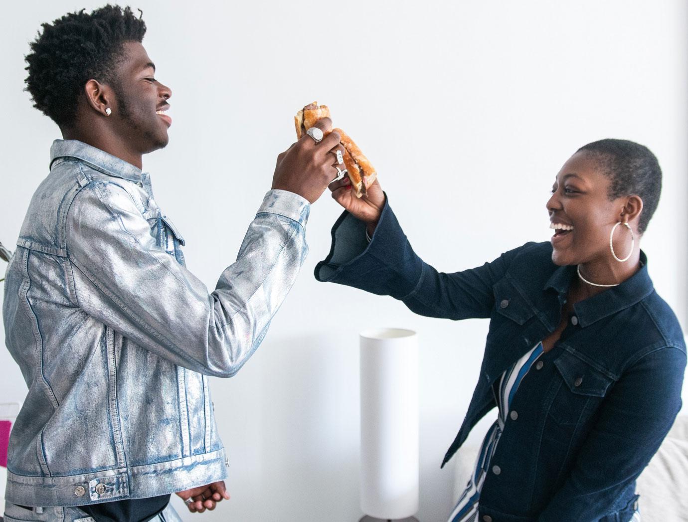 Lil'Nas X surprises someone by bringing them their panera delivery.