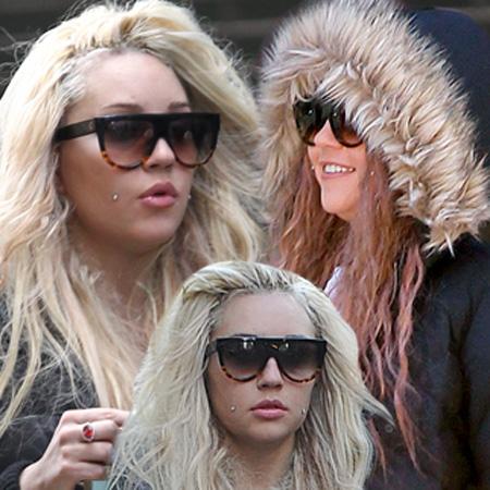 Amanda Bynes walks around New York City with blue scarf covering