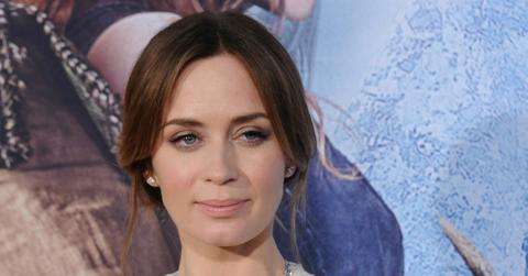 Emily Blunt wears a sleeveless flowing v-neck dress and hair in an updo at The Huntsman Winter's War premiere in 2016.