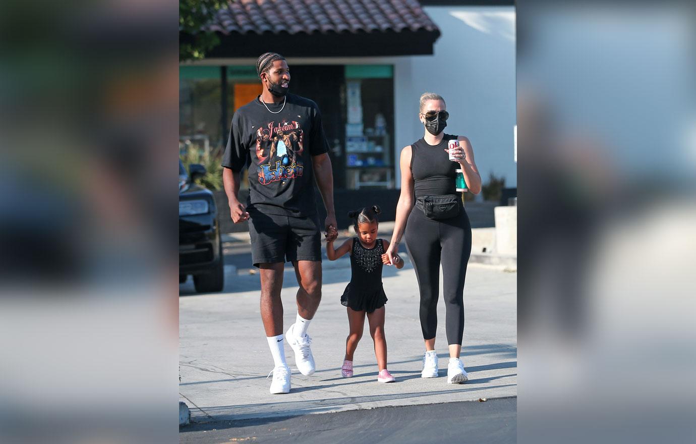 khloe kardashian not bothered tristan thompson holding hands mystery woman