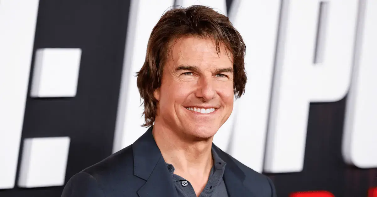 Photo of Tom Cruise smiling at premiere.