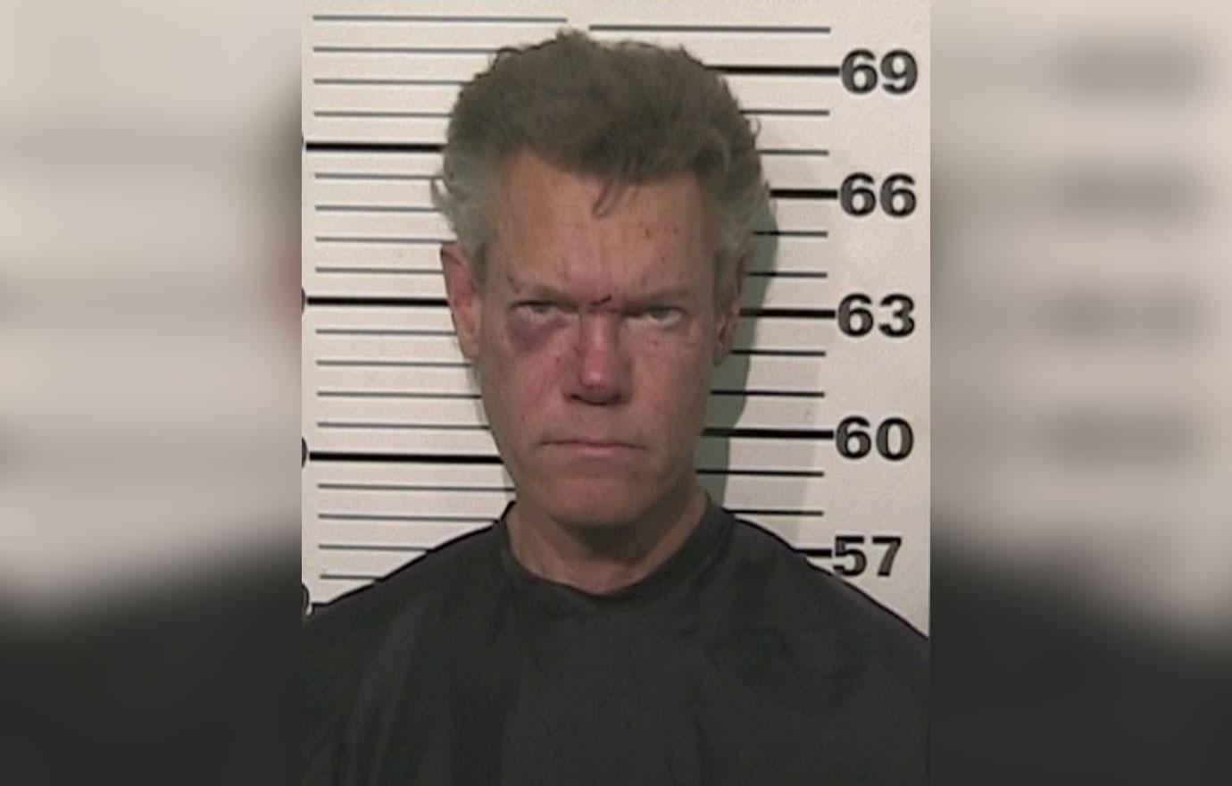 In this handout provided by the Grayson County Sheriff’s Office, musician Randy Travis is seen in a police booking photo August 7, 2012 in Sherman, Texas. Travis was charged with misdemeanor DWI and felony Retaliation after he was involved in a one vehicle accident. He was later released on bond.