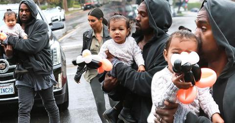 Kanye Kisses North West