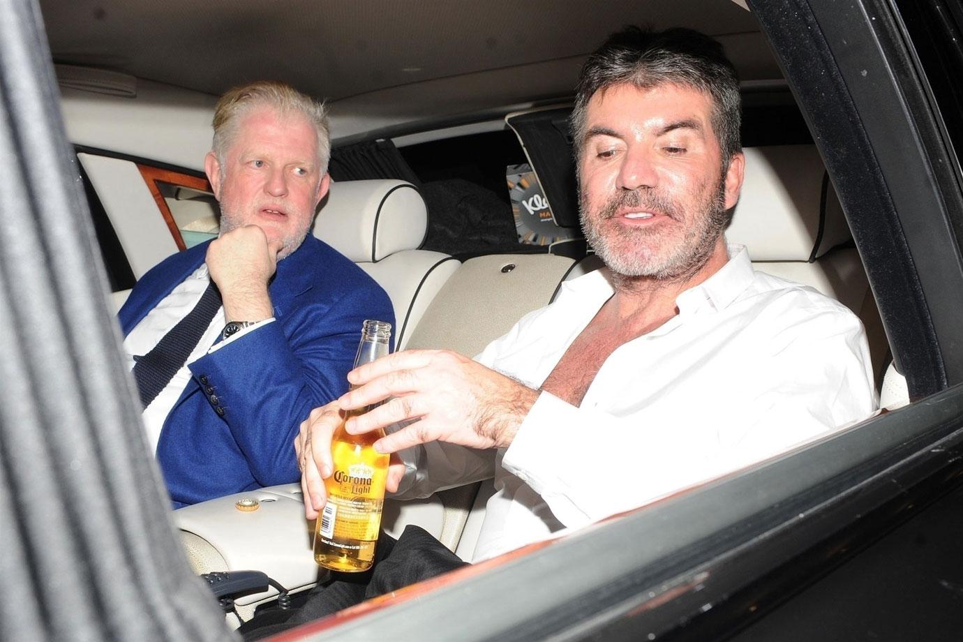 //Simon Cowell drinking after hospital