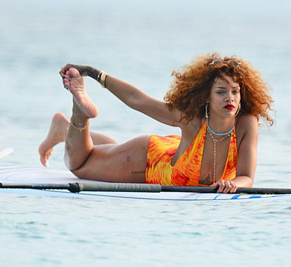 //rihanna swimsuit paddleboarding photos