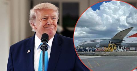 A photo of Donald Trump alongside the Qatari 747-8 jet