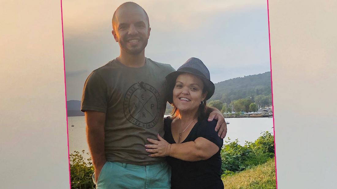 Christy McGinity with her new man in front of a lake.