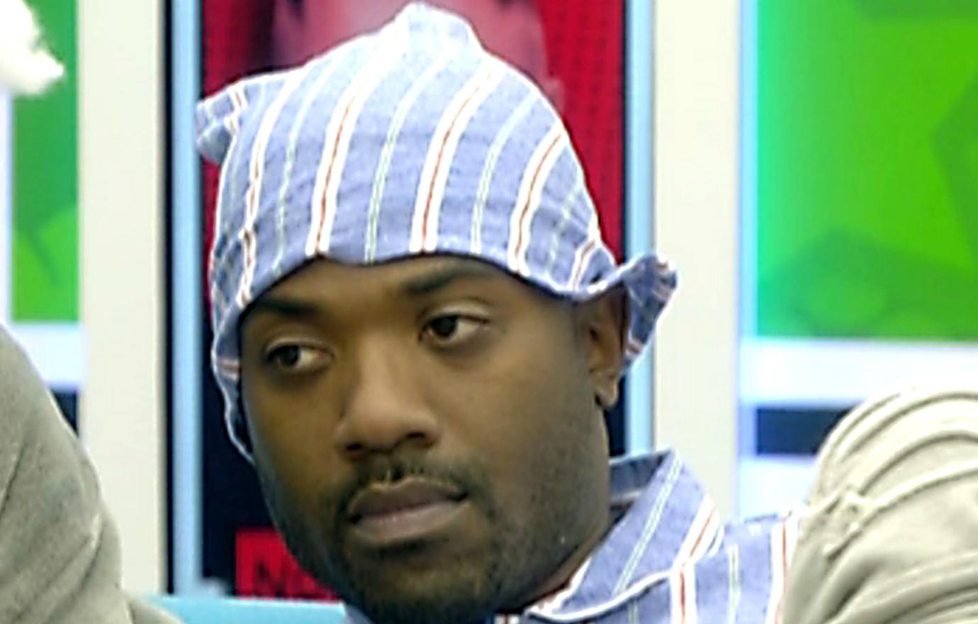 Ray J wears blue striped PJs and a cap made from the same material.