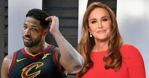 Caitlyn Jenner wears a red dress. Tristan Thompson wears his Cleveland Cavaliers jersey.