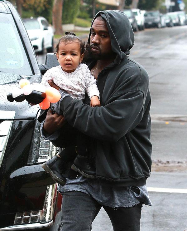 Kanye Kisses North West