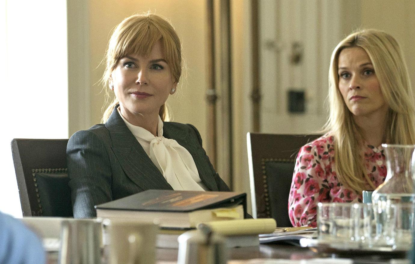 Nicole Kidman wore a grey business suit with a white blouse, while Reese Witherspoon sported a pink flower spotted dress in Big Little Lies.