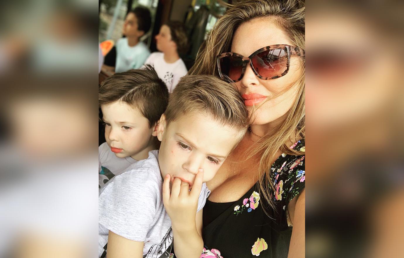 Emily Simpson Selfie With Sons Smiling Wearing Sunglasses and Floral Top