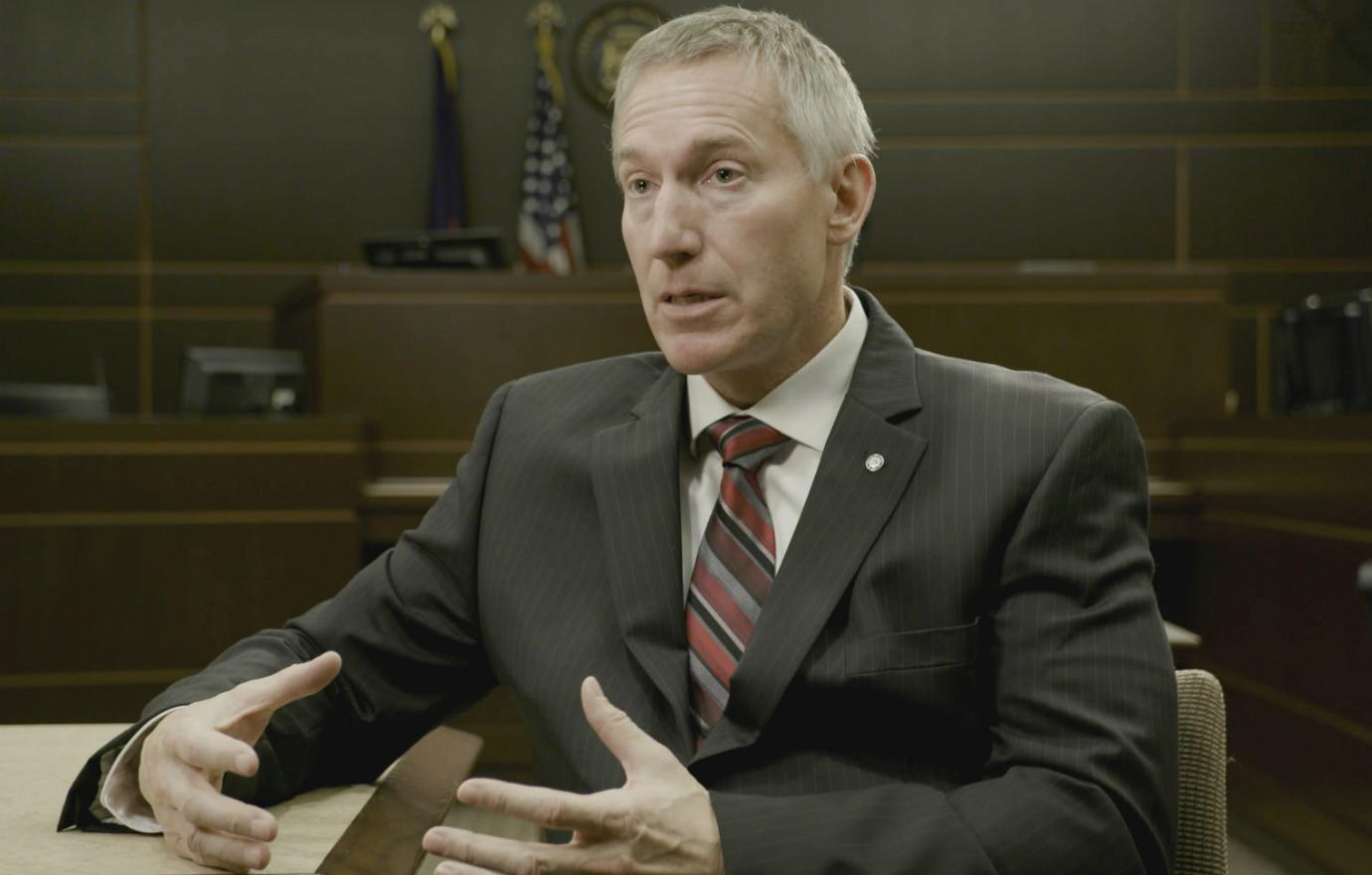 An interview subject for the Netflix true crime documentary, The Confession Tapes, laid out his case in a brown striped suit and tie.