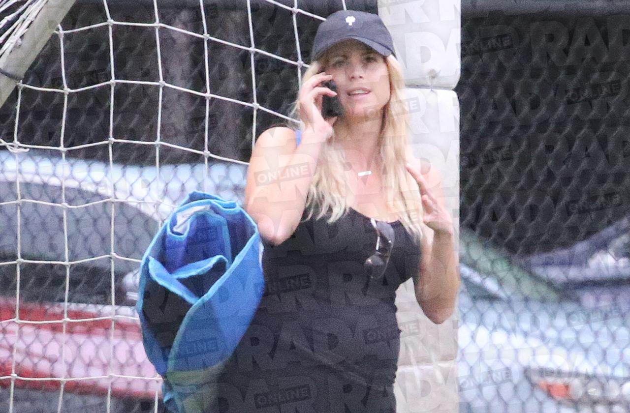 Elin Nordegren is seen pregnant and wearing a black top.