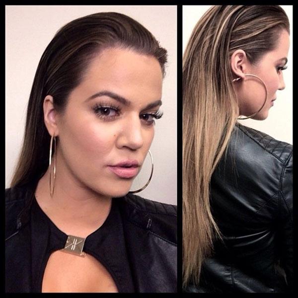 Khloe Kardashian showing off her lighter slicked back blonde locks while in Australia in a new pic she shared. Khloe says