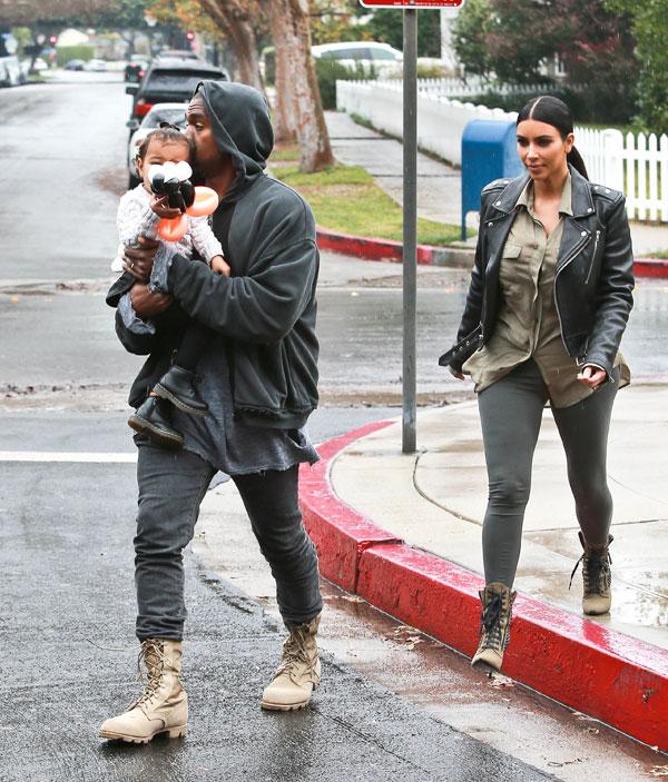 Kanye Kisses North West