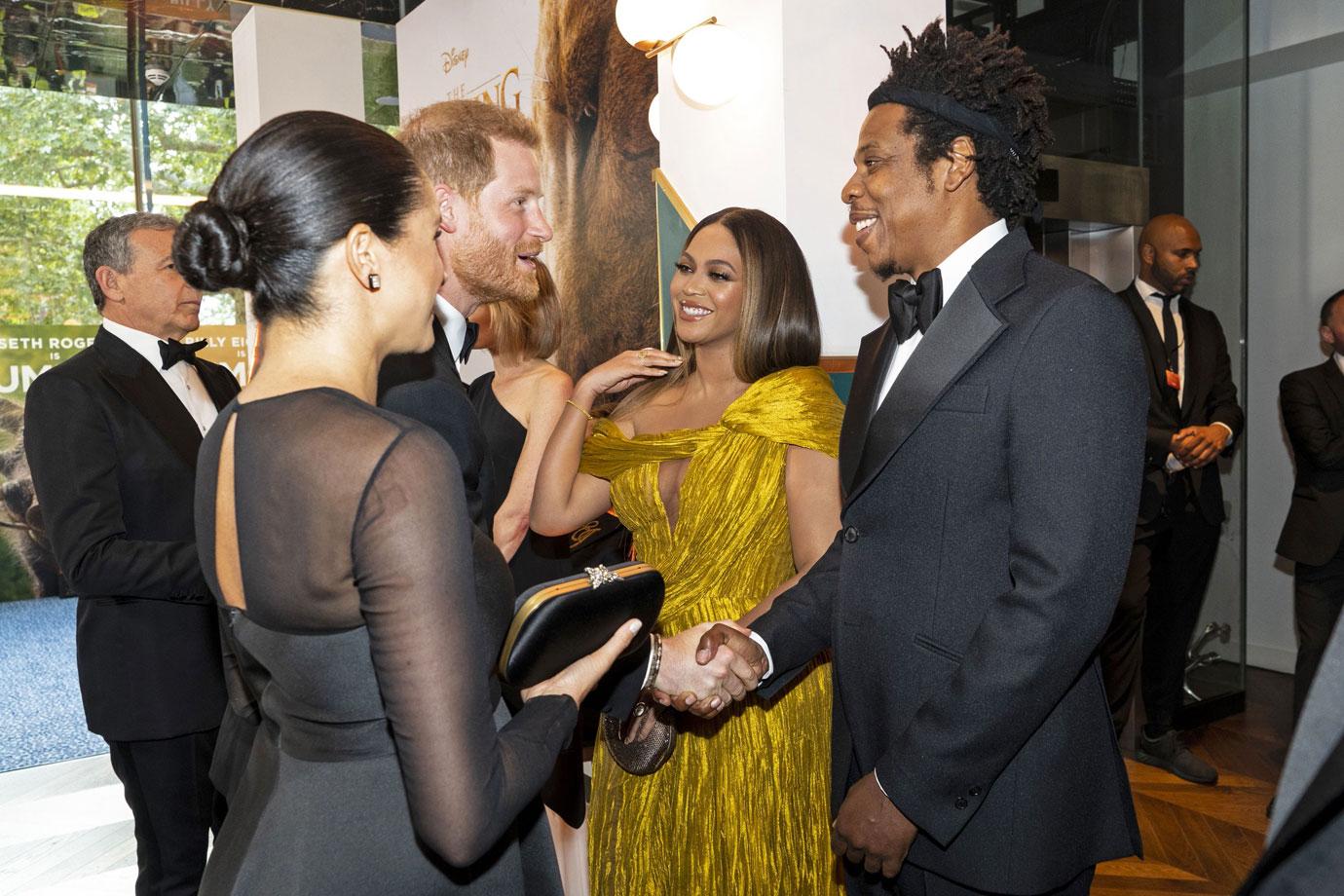 Britain's Prince Harry, Duke of Sussex (3rd L) and Britain's Meghan, Duchess of Sussex (2nd L) meet cast and crew, including US singer-songwriter Beyoncé (C) and her husband, US rapper Jay-Z (R) as they attend the European premiere of the film The Lion King in London on July 14, 2019.