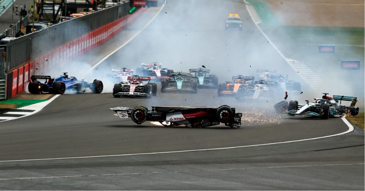 zhou guanyu flips skids  meters crash british grand prix