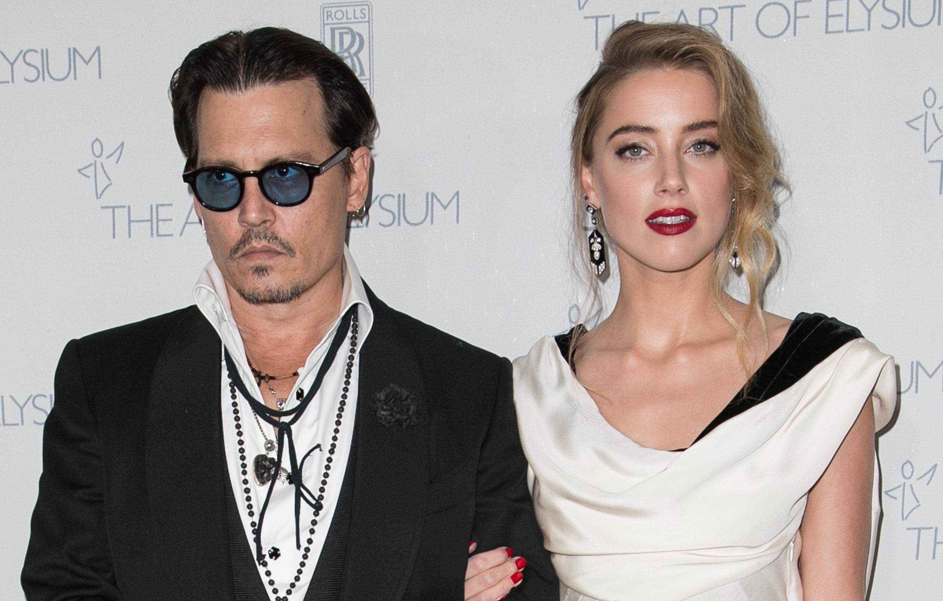 johnny depp accuses amber heard calling paparazzi