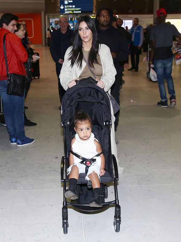 Kim Kardashian Kanye North West Photos -- Toddler Smiles As Family Arrives In Paris