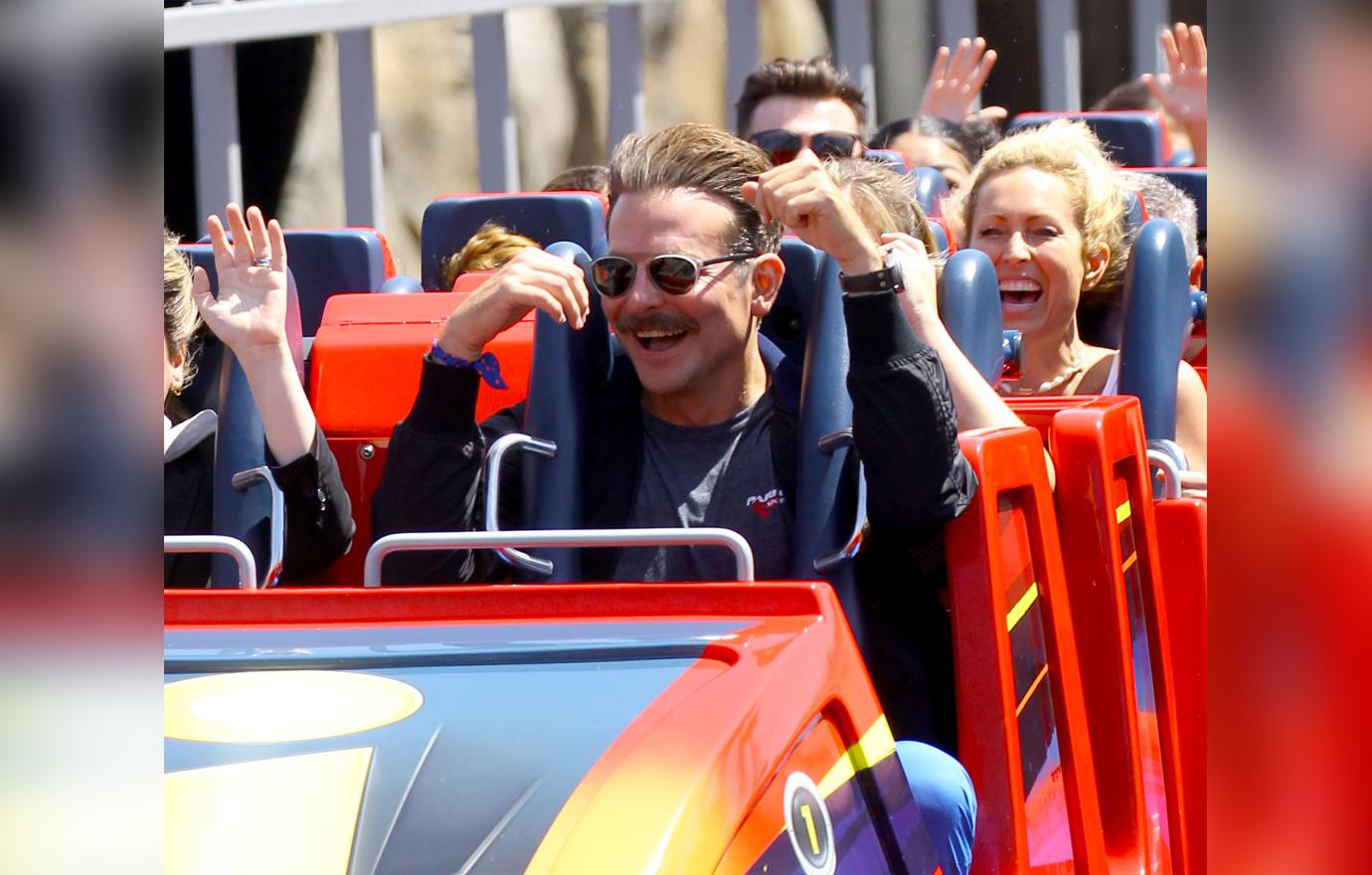 Bradley Cooper enjoys a day at Disneyland with his daughter Lea.