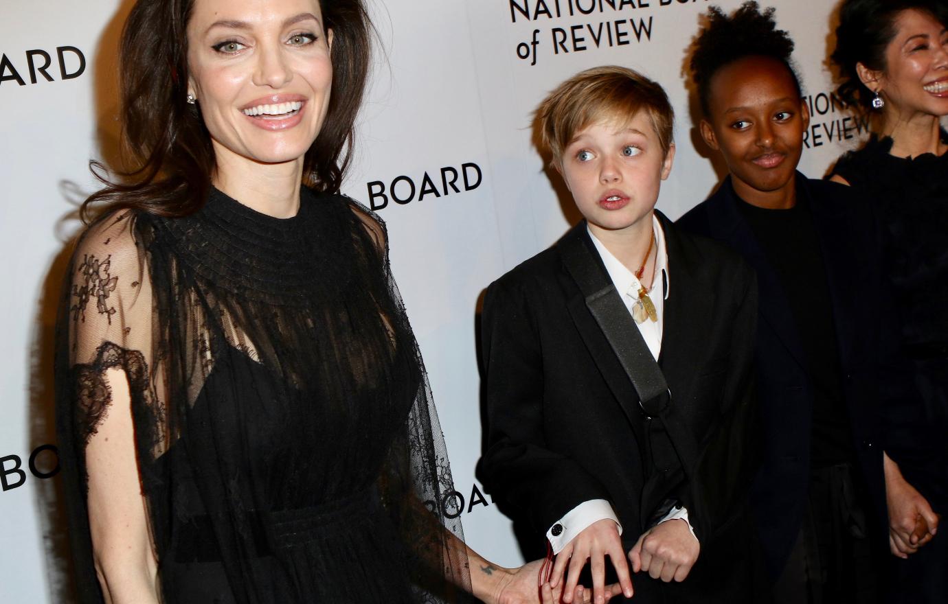 Angelina Jolie with 3 of her kids at a red carpet event