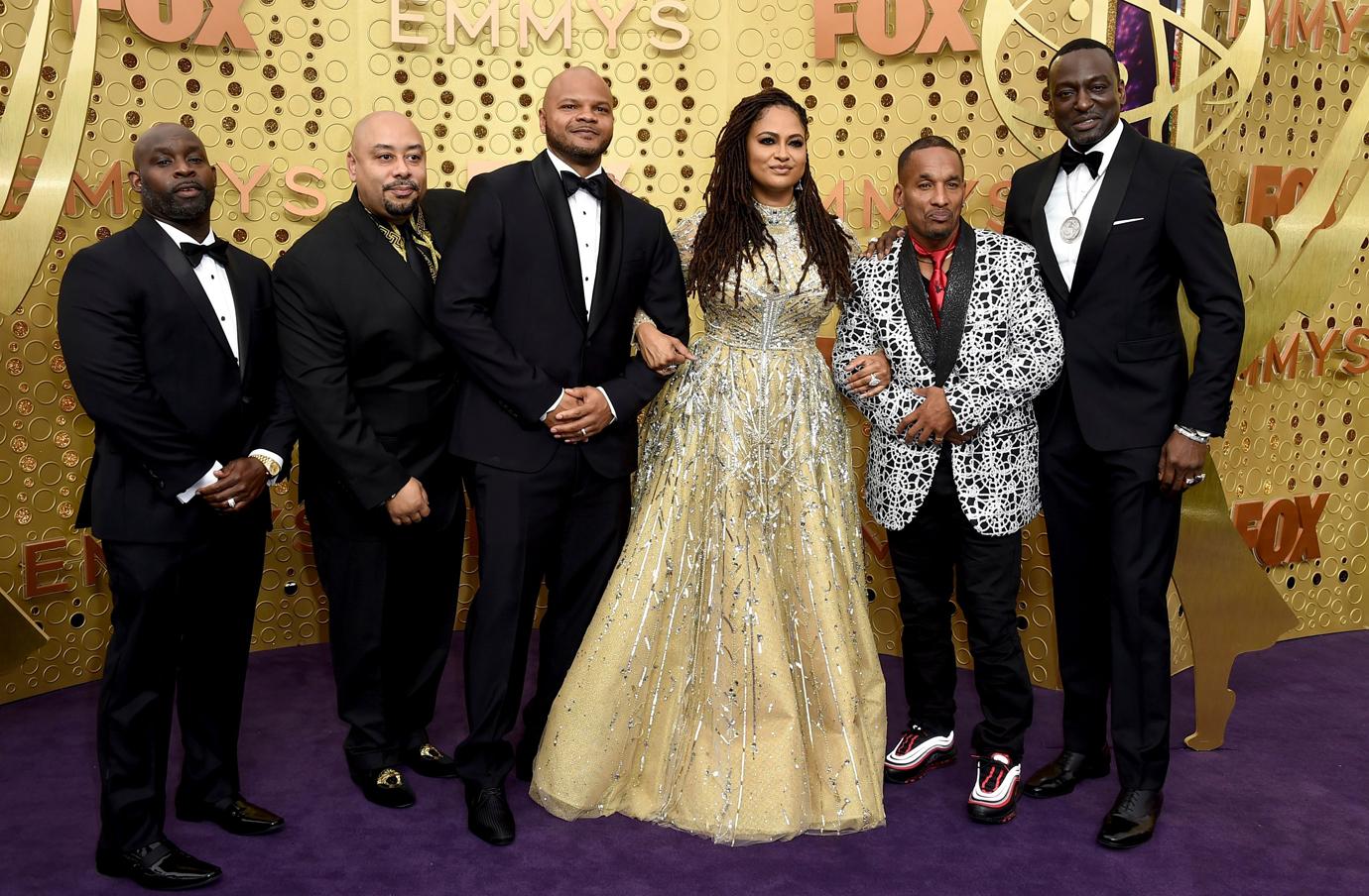 Ava DuVernay, center, is joined by Antron McCray, Raymond Santana, Kevin Richardson, Korey Wise and Yusef Salaam, of the Central Park 5, during arrivals of the 71st Primetime Emmy Awards