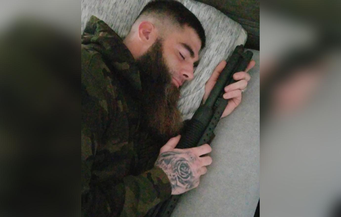 David Eason Sleeping Holding Gun