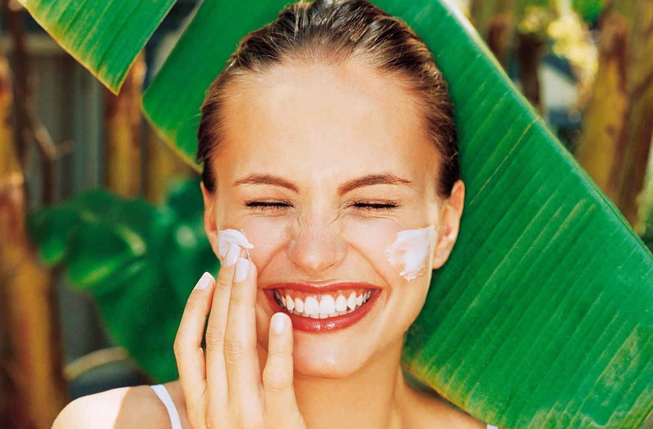 Woman Applying Sunscreen