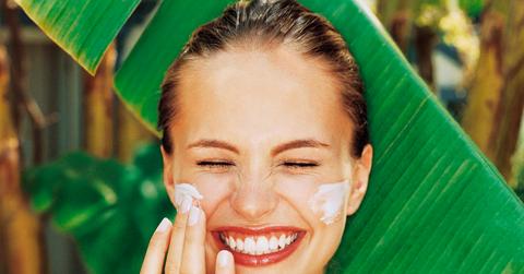 Woman Applying Sunscreen