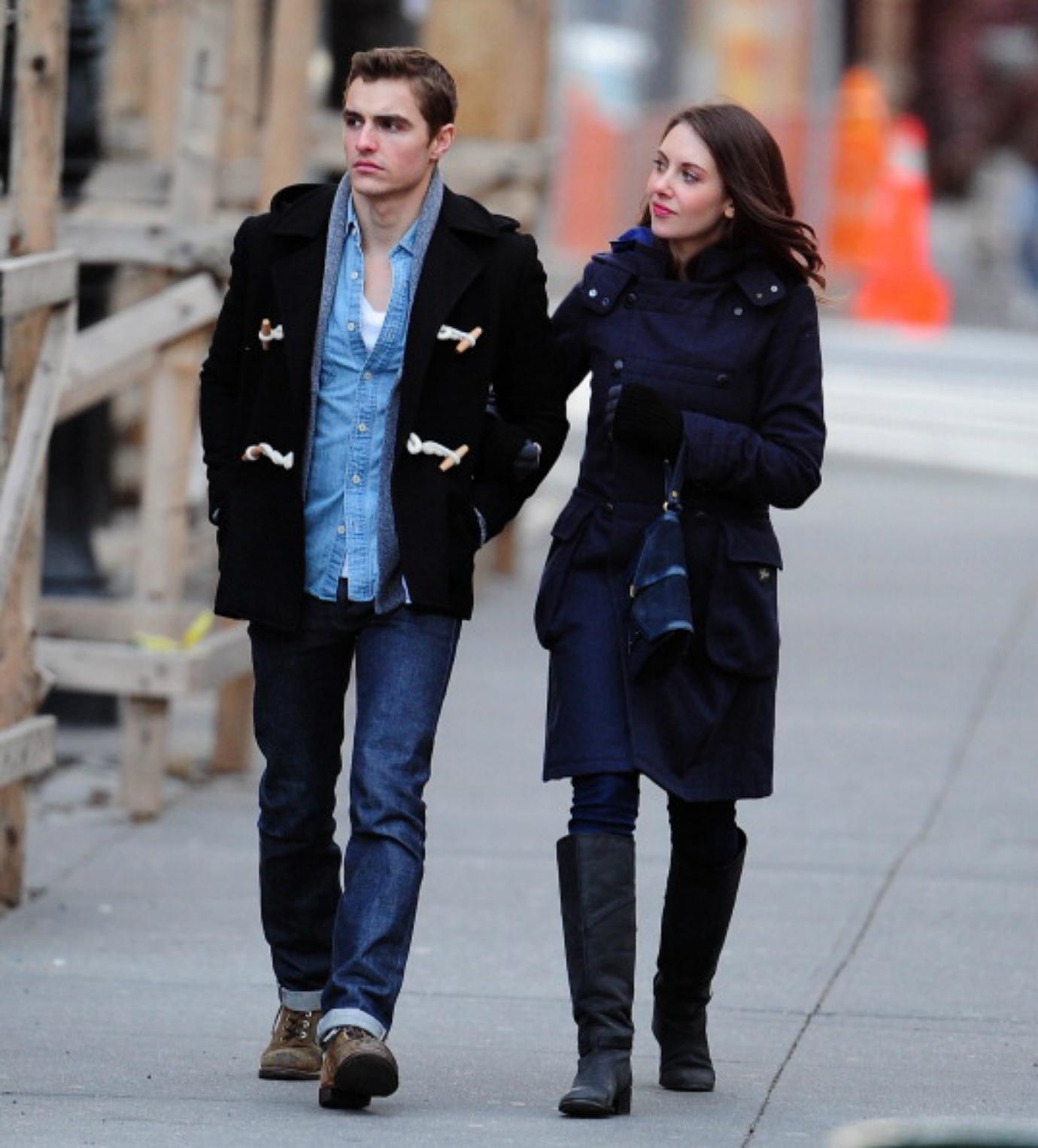 Alison Brie and Dave Franco walk arm in arm.