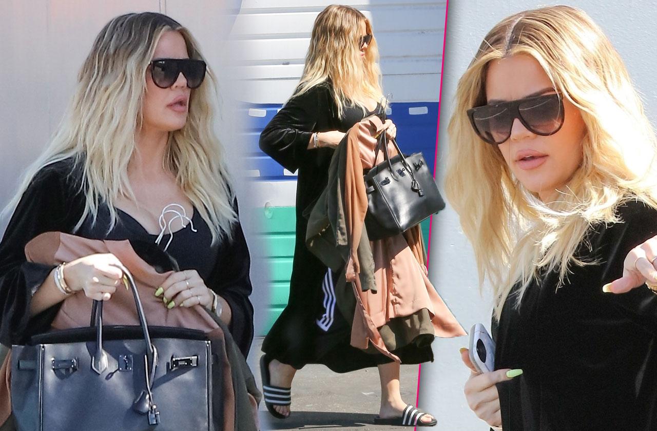 Khloe Kardashian covers baby bump