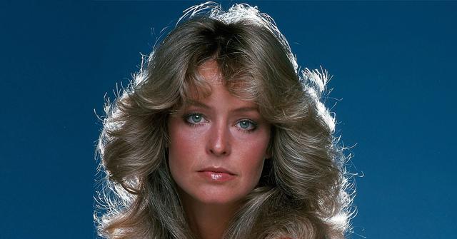 Farrah Fawcett wears a green and red stripped white shirt.