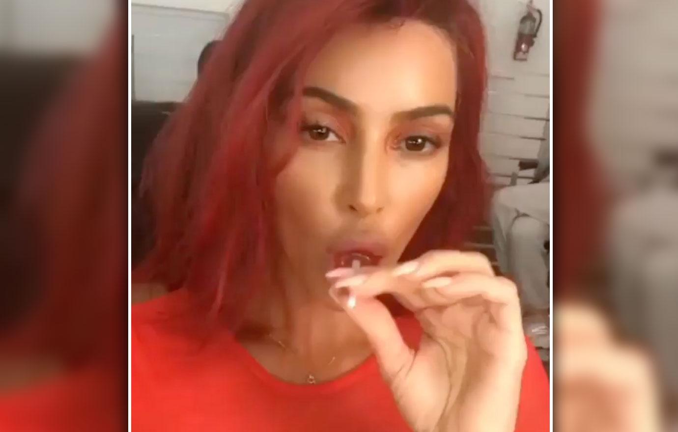 Kim Kardashian Debuts Red Hair Sucks Lollipop