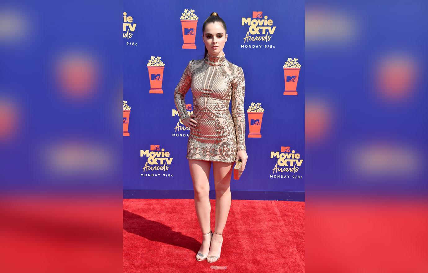 Vanessa Marano wears a silver patterned dress.