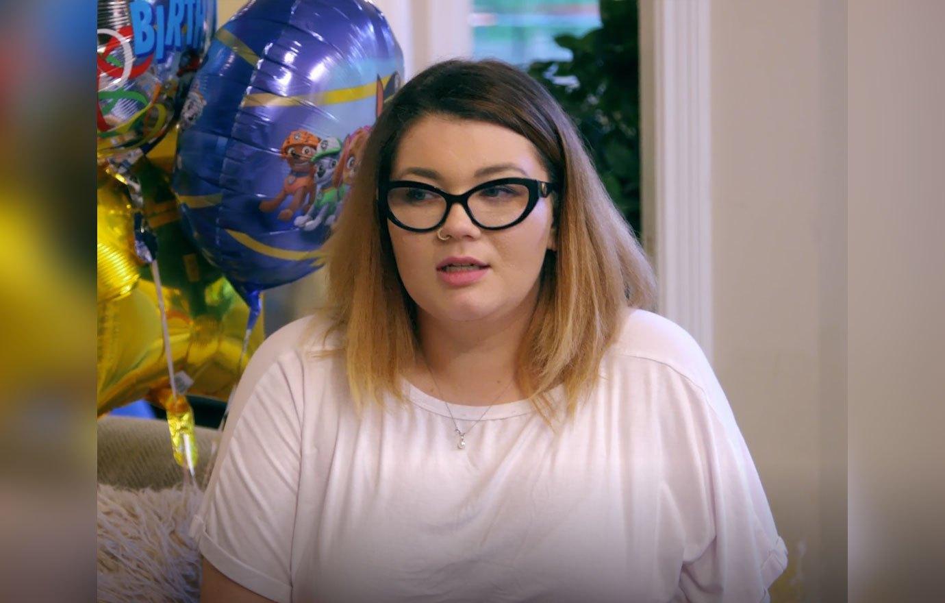 Amber Portwood Sitting With Child Looking Serious