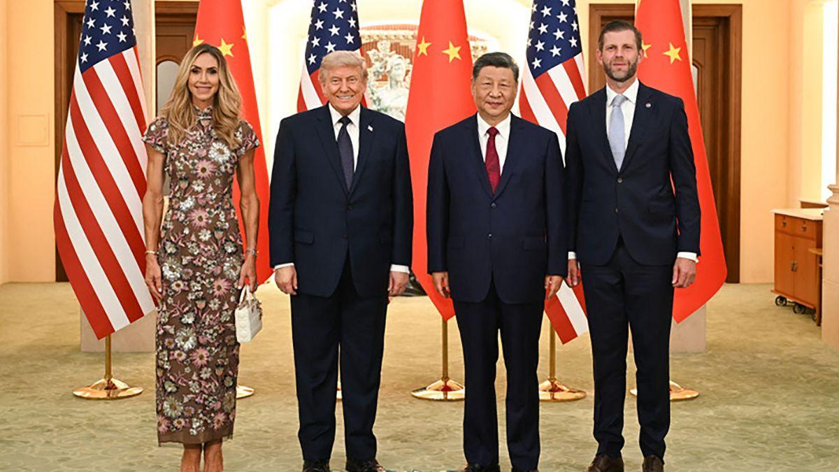 image of Critics branded one viral image featuring Lara, Donald, Eric, and Xi as 'not a normal family photo.'