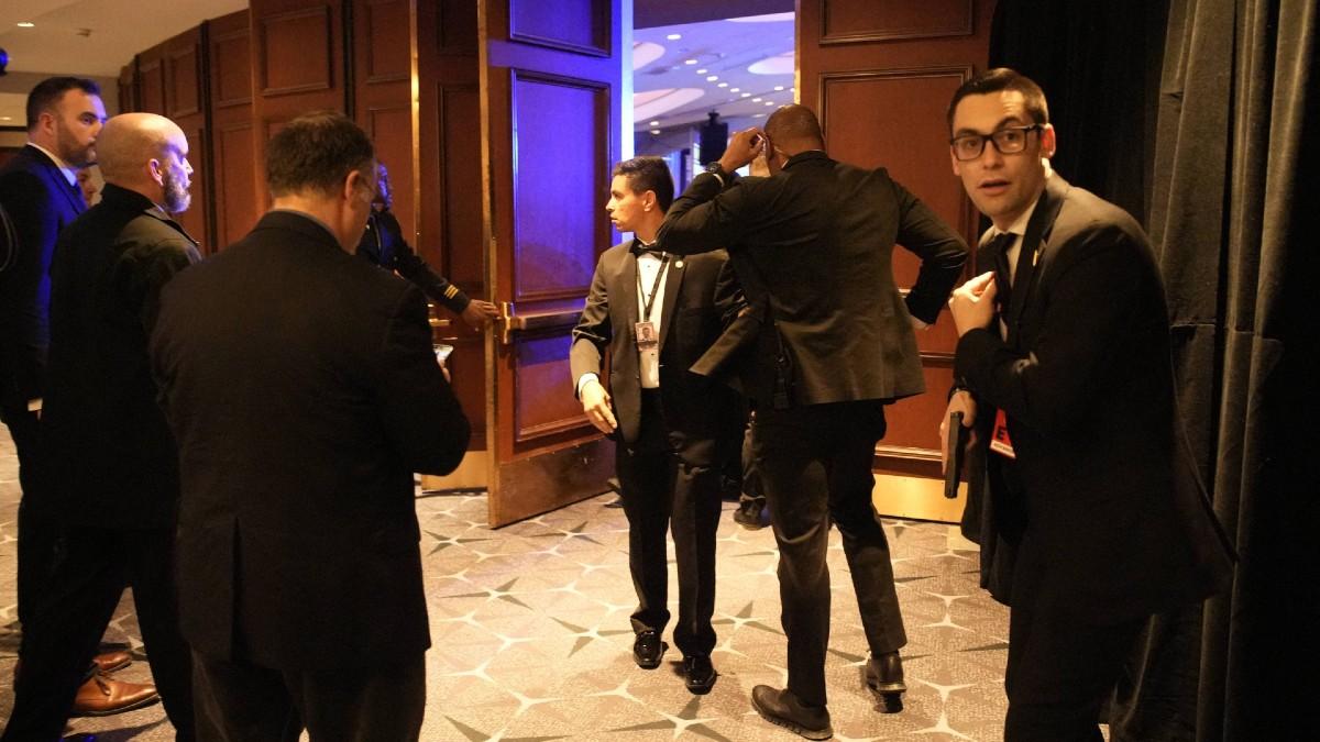 Secret Service agents flooded the ballroom.