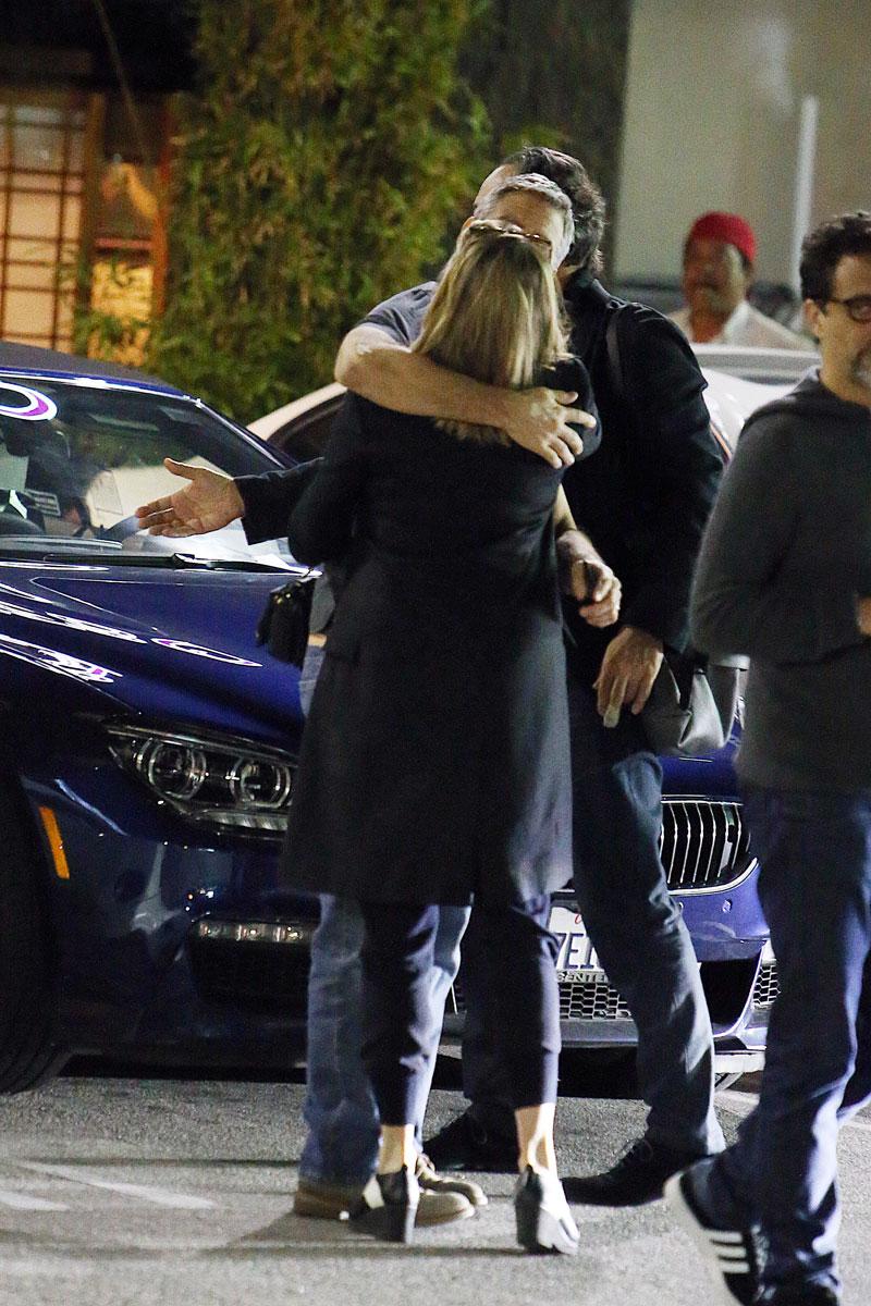 //george clooney kissing mystery woman blonde